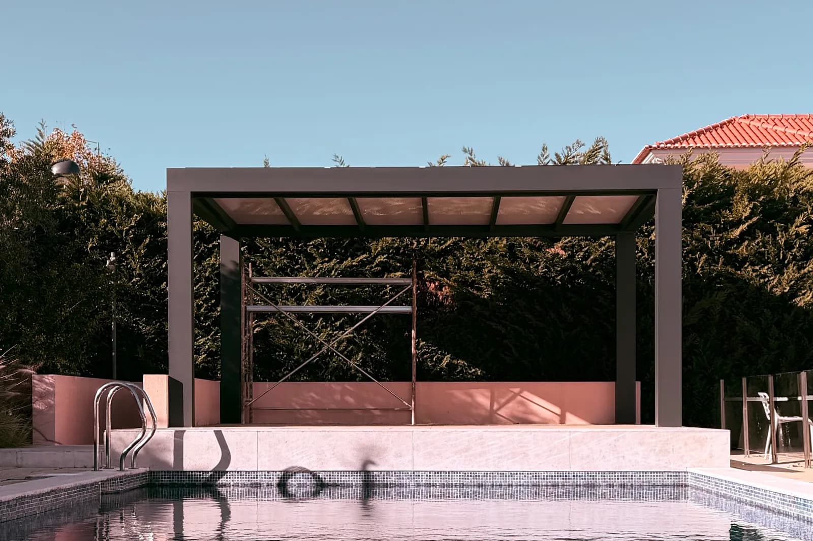 New fixed-roof pergola by the pool at Quinta da Beloura
