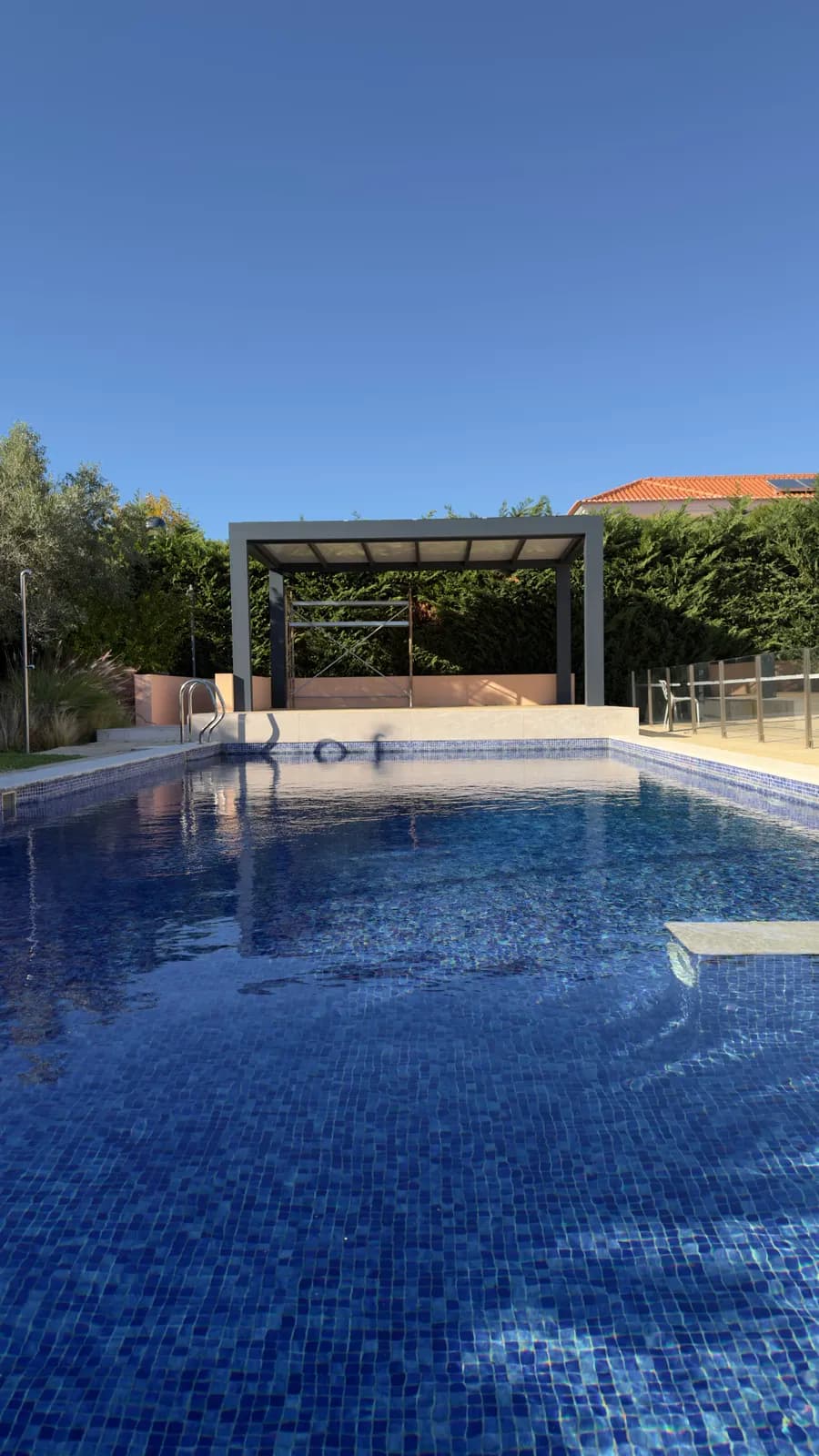 The new pergola seen from across the pool