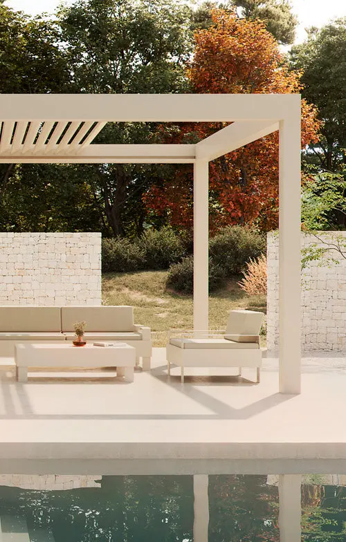 Denia in a garden, with a seating area